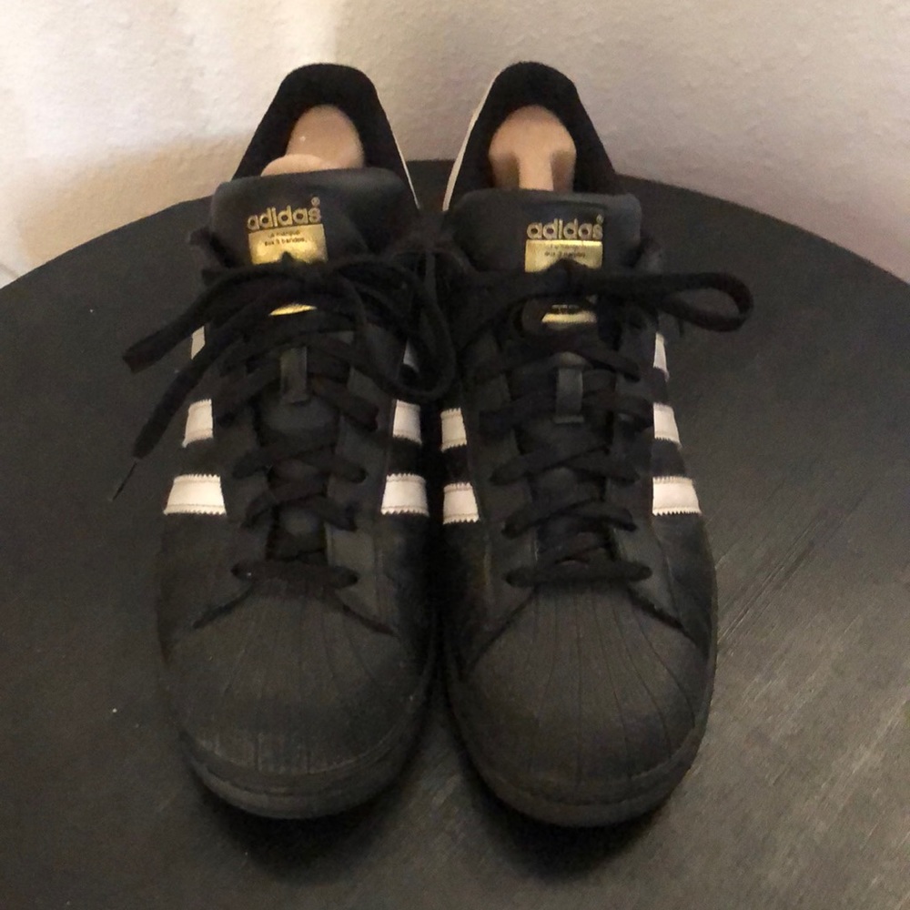 Adidas Superstar black and gold size 10.5